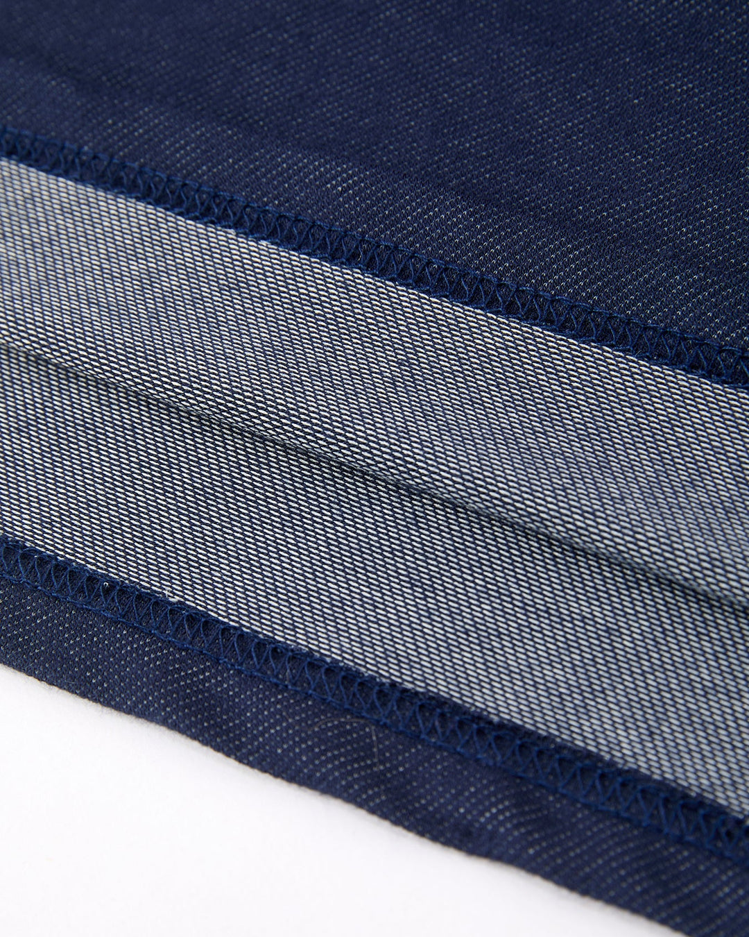 Close-up of blue and gray fabric with a white background