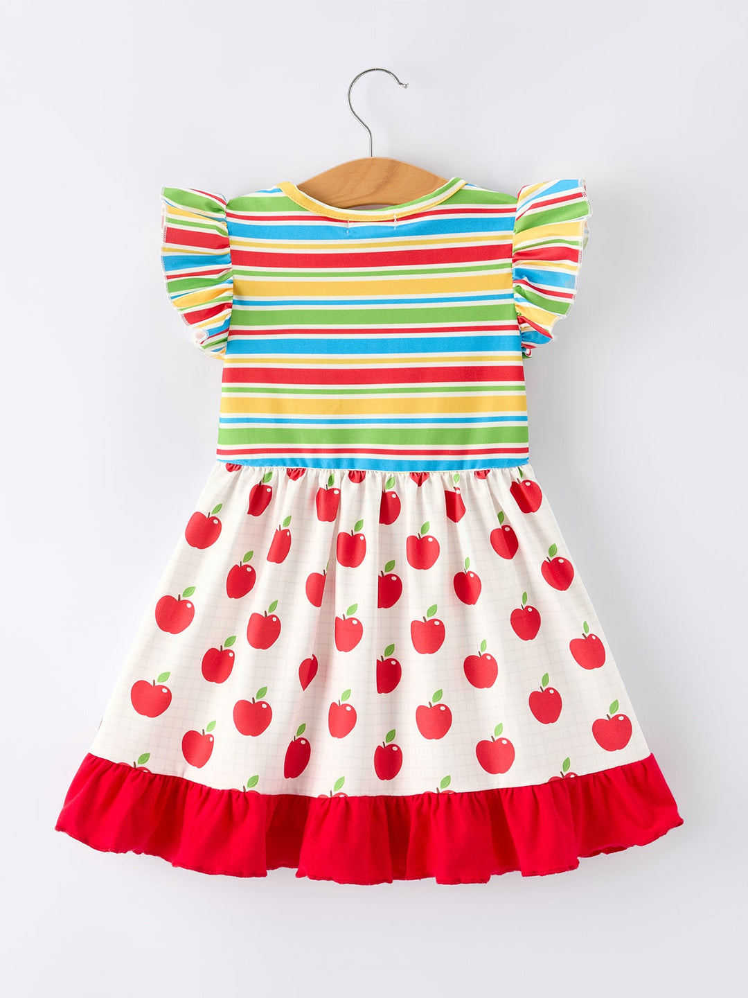 Colorful striped dress with red apple pattern on a white background