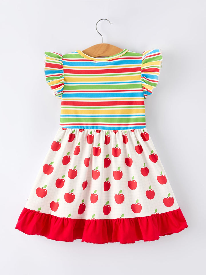 Colorful striped dress with red apple pattern on a white background