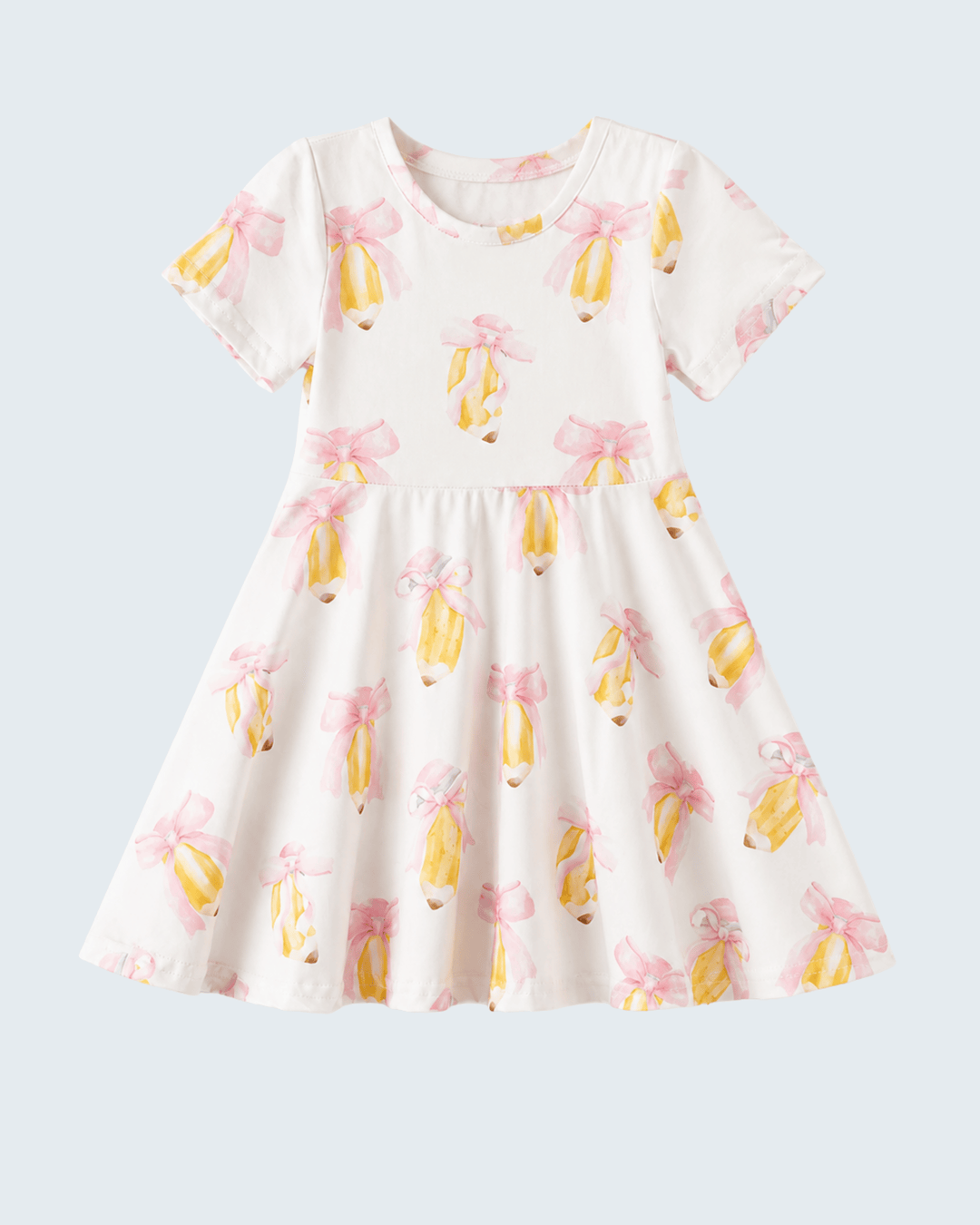 White dress with yellow and pink floral pattern on a light gray background