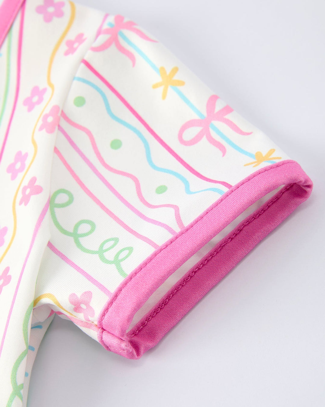 Baby dress with colorful designs on a white background