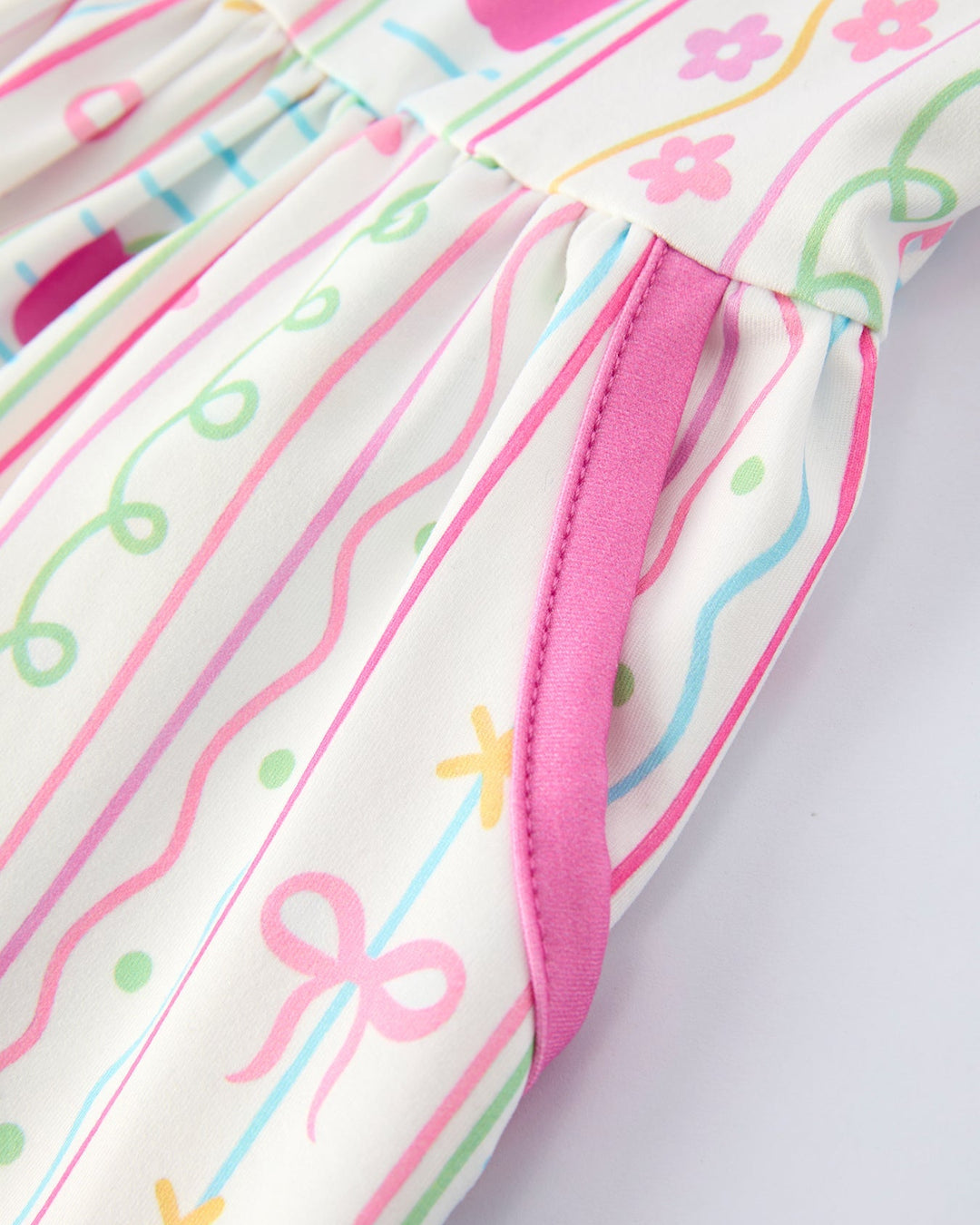 Close-up of a dress with colorful patterns on a white background