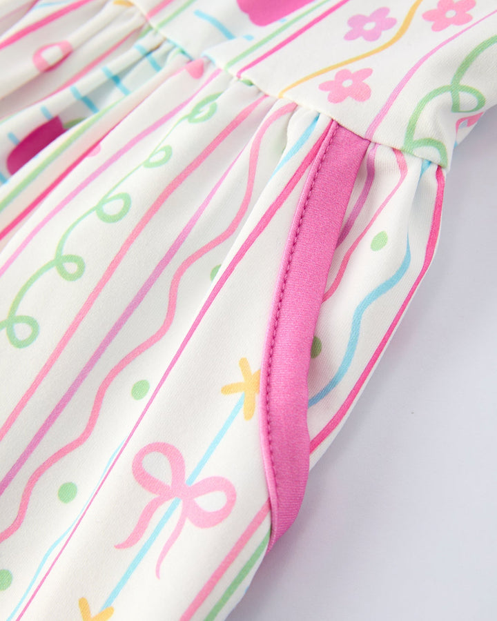 Close-up of a dress with colorful patterns on a white background
