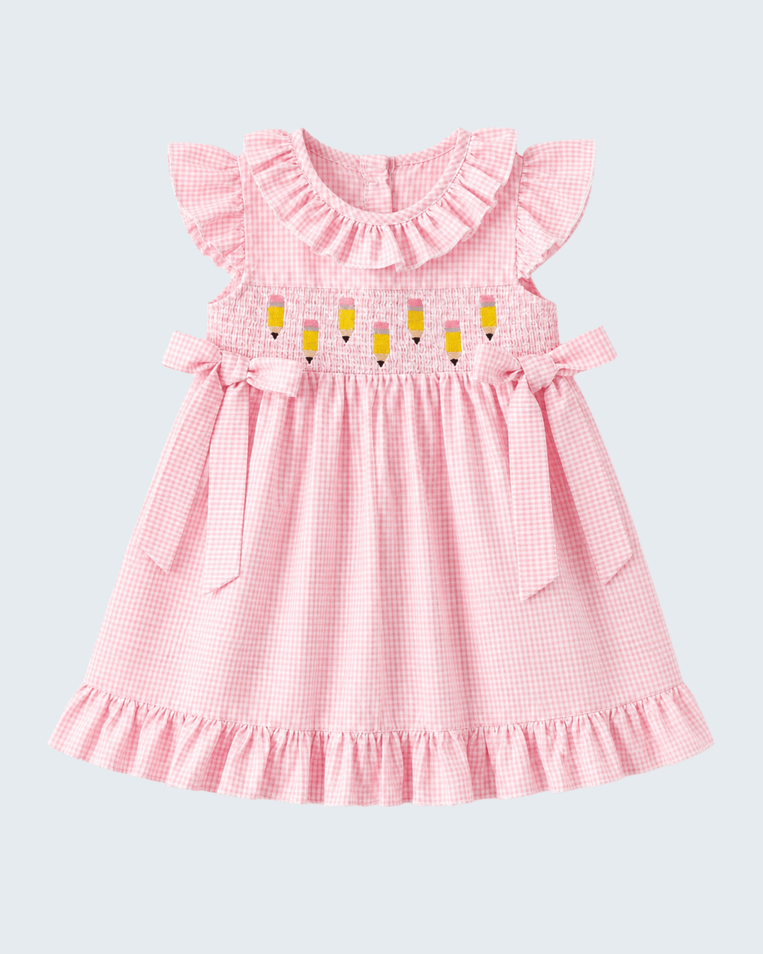 Pink checkered dress with ruffled sleeves and yellow accents on a light gray background