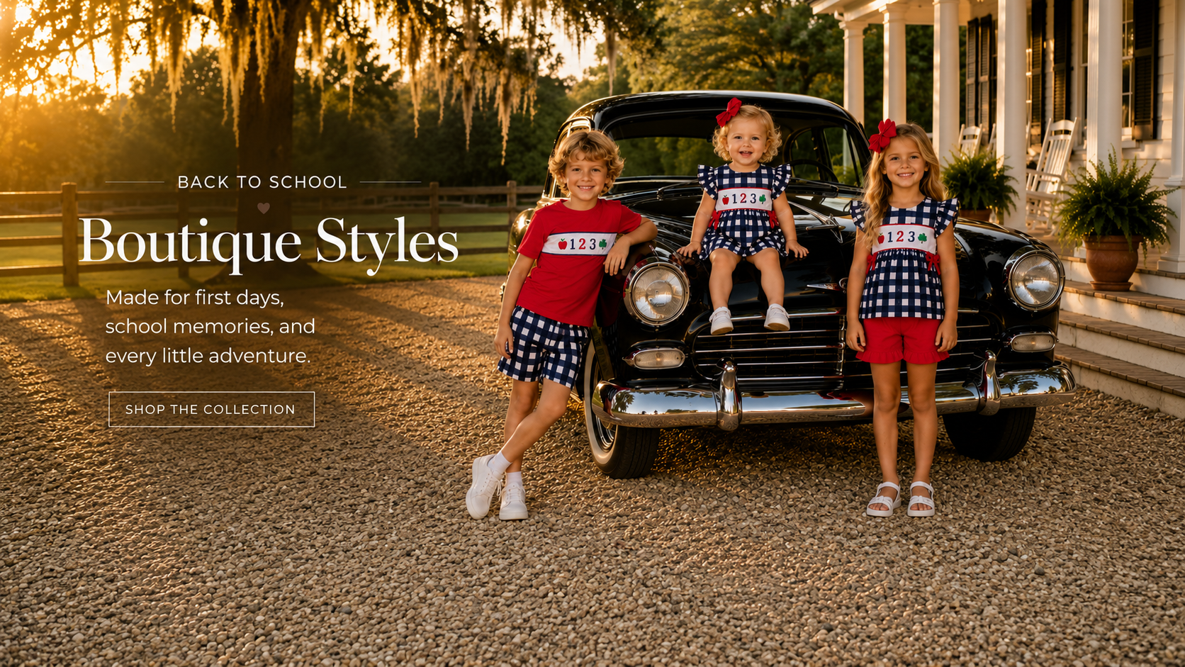 Three young girls modeling matching red and navy patriotic outfits stand in front of a vintage black car on a gravel driveway, with a house and trees in the background. Text on the left reads 'BACK TO SCHOOL Boutique Styles Made for first days, school memories, and every little adventure.