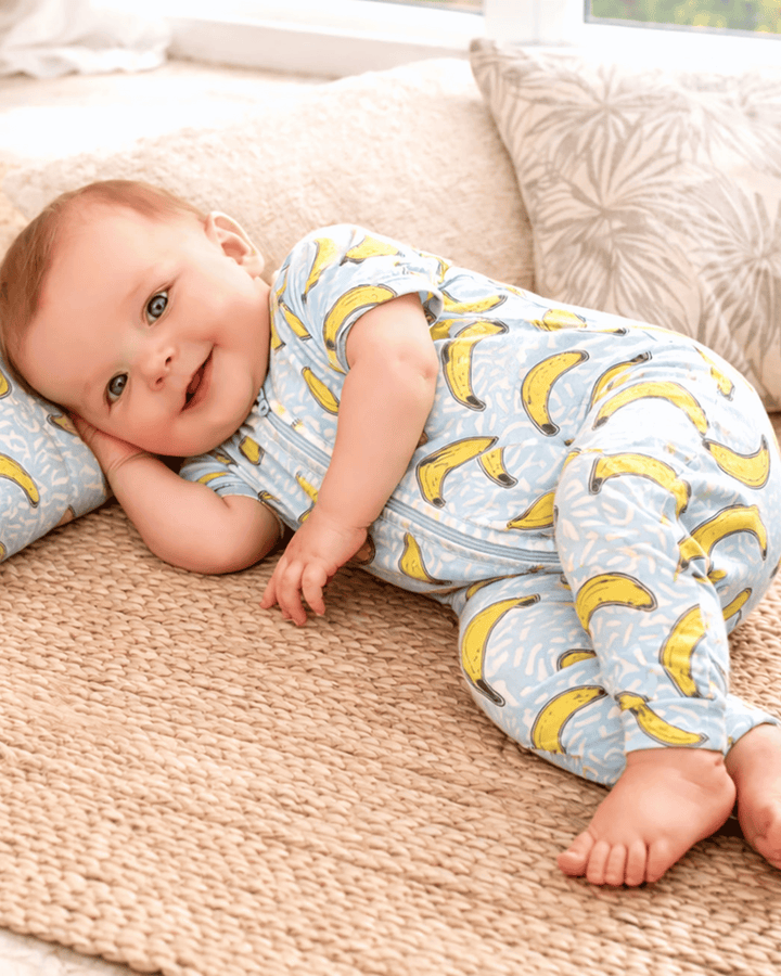 baby boy in onesie with banana print.