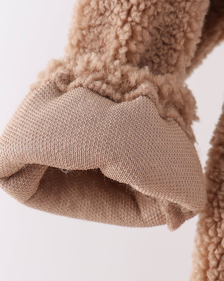 Beige fleece jacket sleeve with ribbed cuff and layered hem