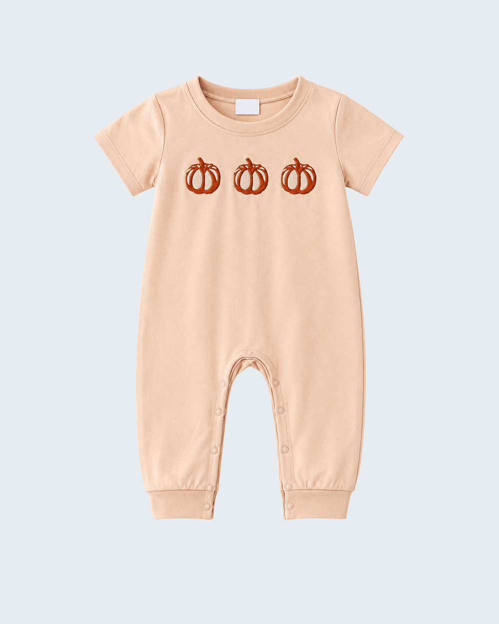 Beige short-sleeve romper with pumpkin embroidery and snap button legs