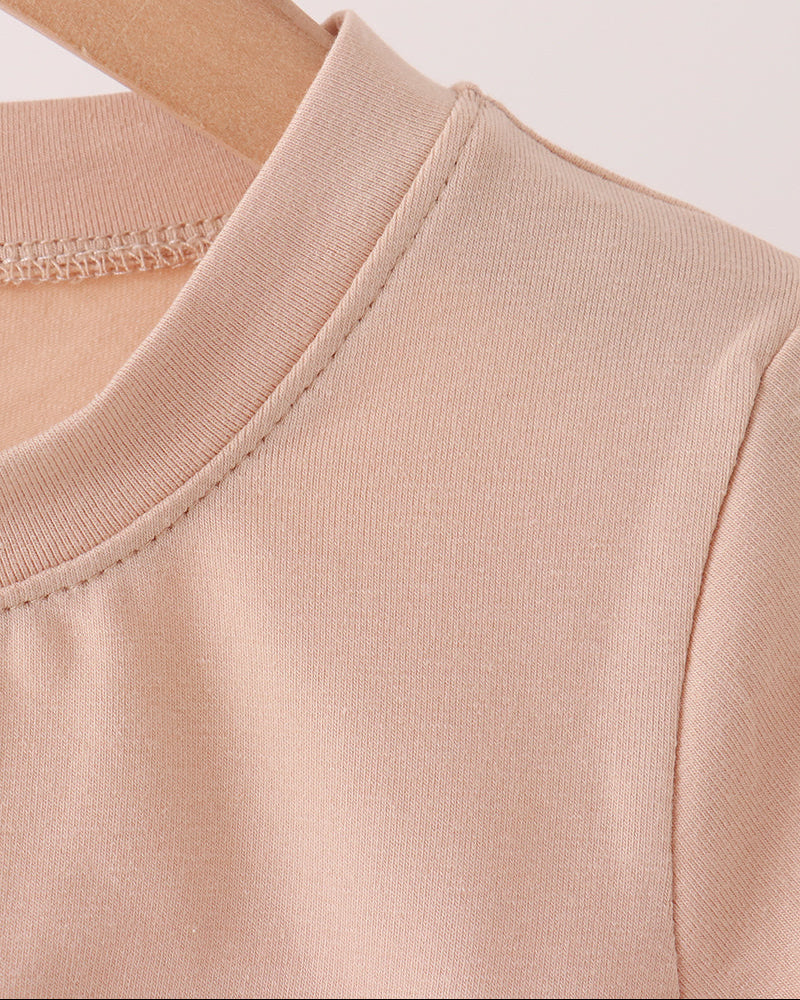Light peach crew-neck T-shirt with neat seam and ribbed collar