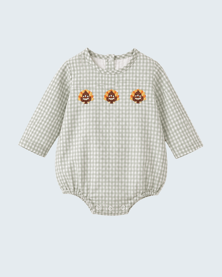 Beige gingham baby bubble romper with embroidered turkey motifs and long sleeves