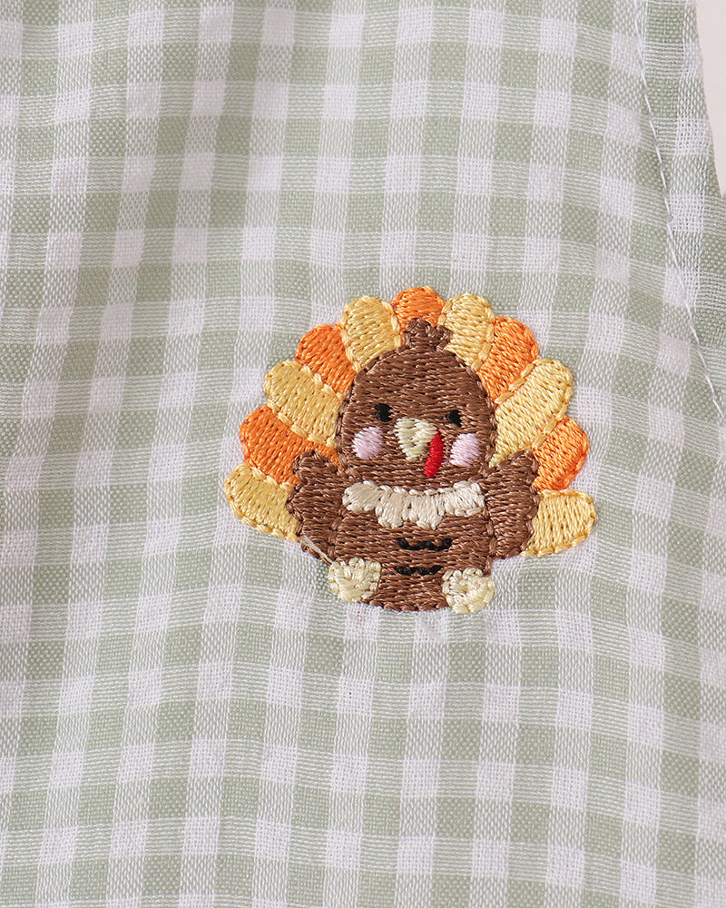 Turkey face applique embroidery on green-and-white gingham jonjon