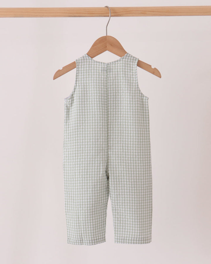 Front view gingham jonjon with turkey applique and suspender-style straps
