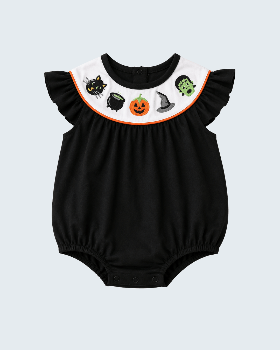 A baby romper in black with a white ruffled collar decorated with Halloween-themed illustrations including a black cat, cauldron, pumpkin, witch hat, and Frankenstein&
