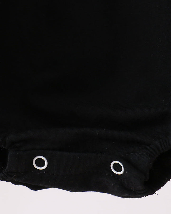 Black romper bottom with snap-button closure and gathered cuff hems