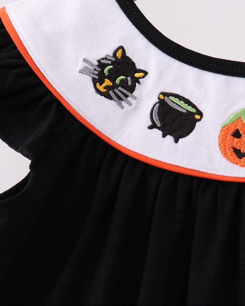 Black dress with white collar and embroidered ghost, pumpkin, and cat appliques