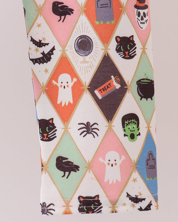 Spooky print pajama pants with diamond pattern cats, ghosts, and jack-o’-lanterns