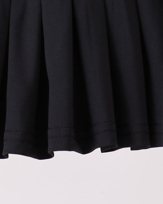 Close-up of a black skirt on a light gray background