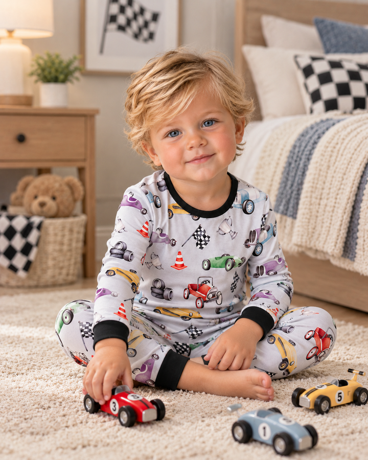 Toddler boy is wearing a Black Racing Bamboo Pajamas
