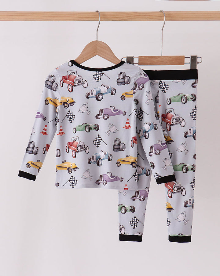 Racing bamboo pajama set with long sleeves, car print, and black collar and cuffs