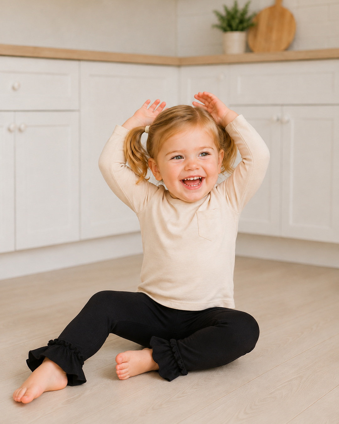 Child wearing black leggings with ruffled ankle cuffs