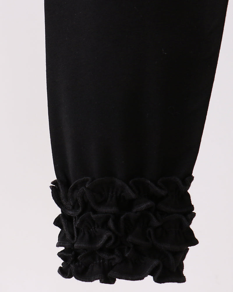 Black leggings with ruffle trim at the ankle cuffs