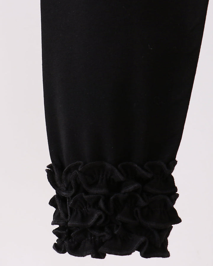 Black leggings with ruffle trim at the ankle cuffs