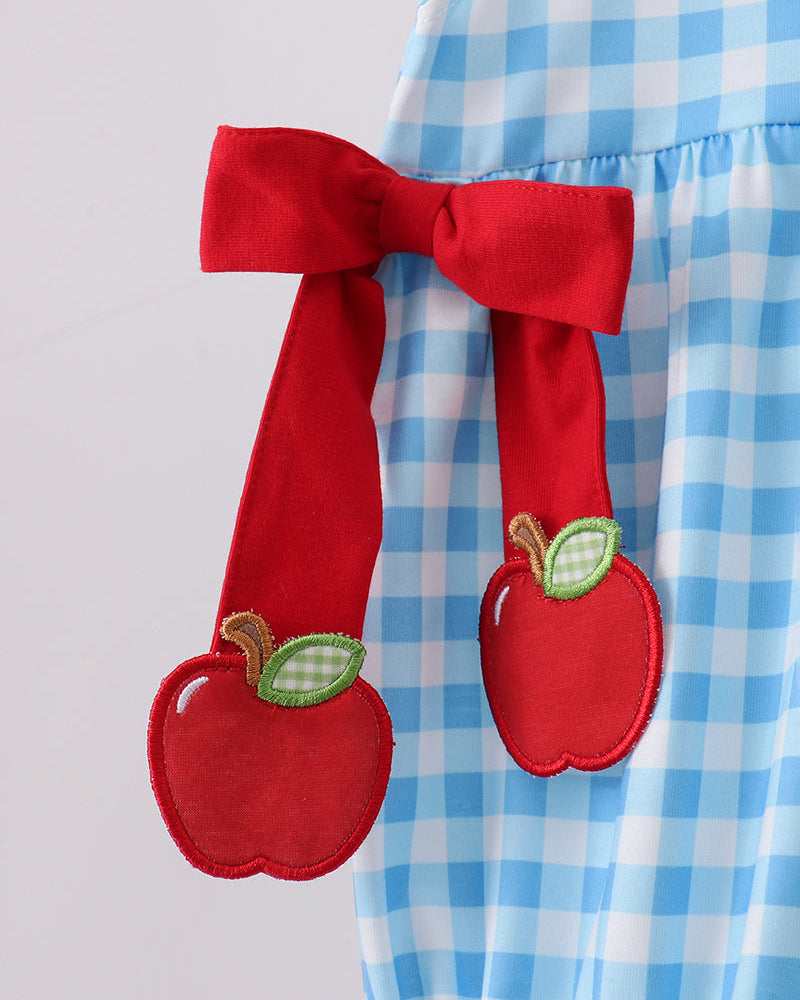 Blue gingham bubble with red apple appliqués and a red bow sash