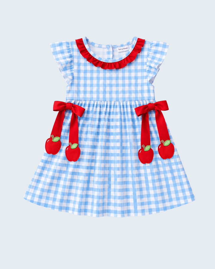 Blue gingham ruffle dress with red neckline trim and apple appliqués