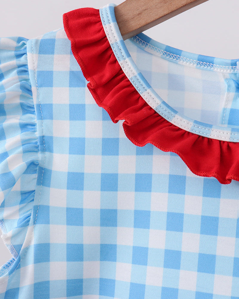 Blue gingham dress with red ruffled neckline trim