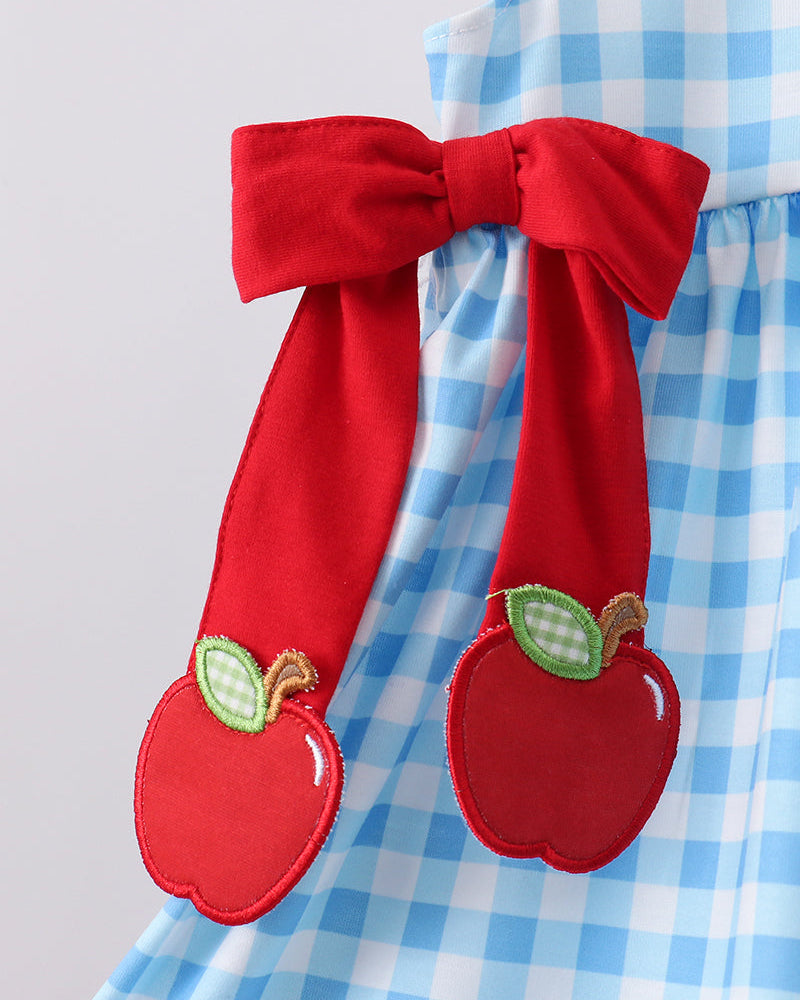 Blue gingham ruffle dress with red bow and apple appliqués