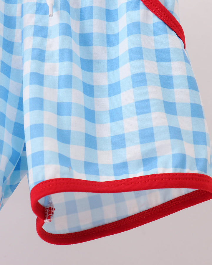 Blue gingham shorts with red-trimmed hem