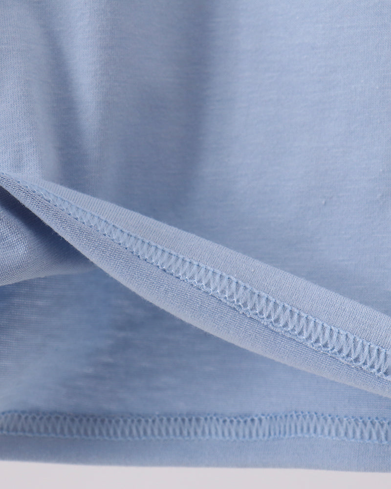 Light blue polo shirt with double-stitched bottom hem and side seams