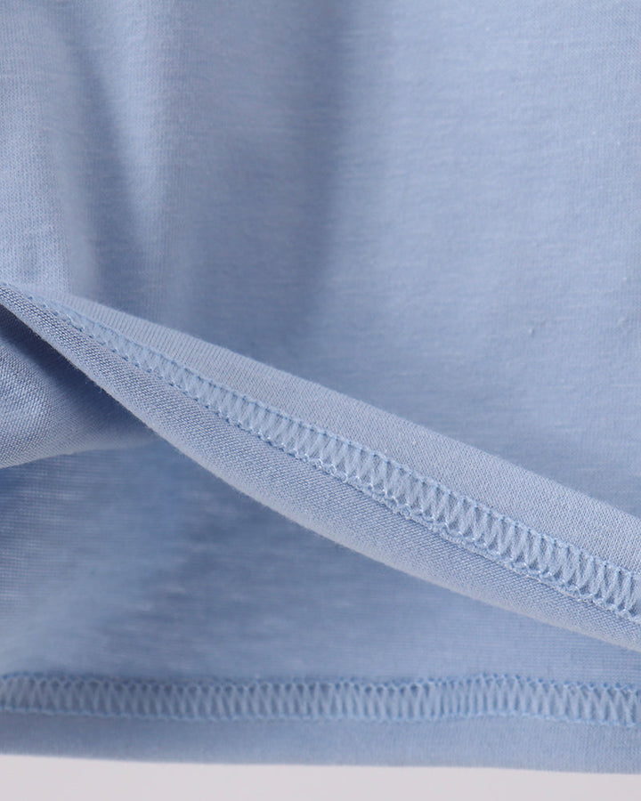 Light blue polo shirt with double-stitched bottom hem and side seams
