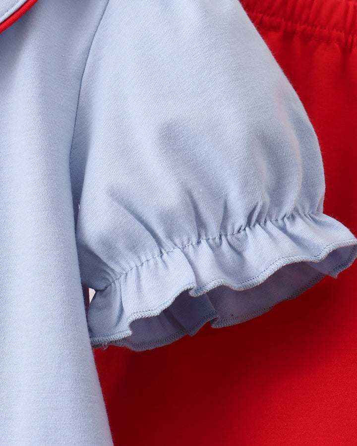 Light blue puff sleeve with elastic cuff and red trim