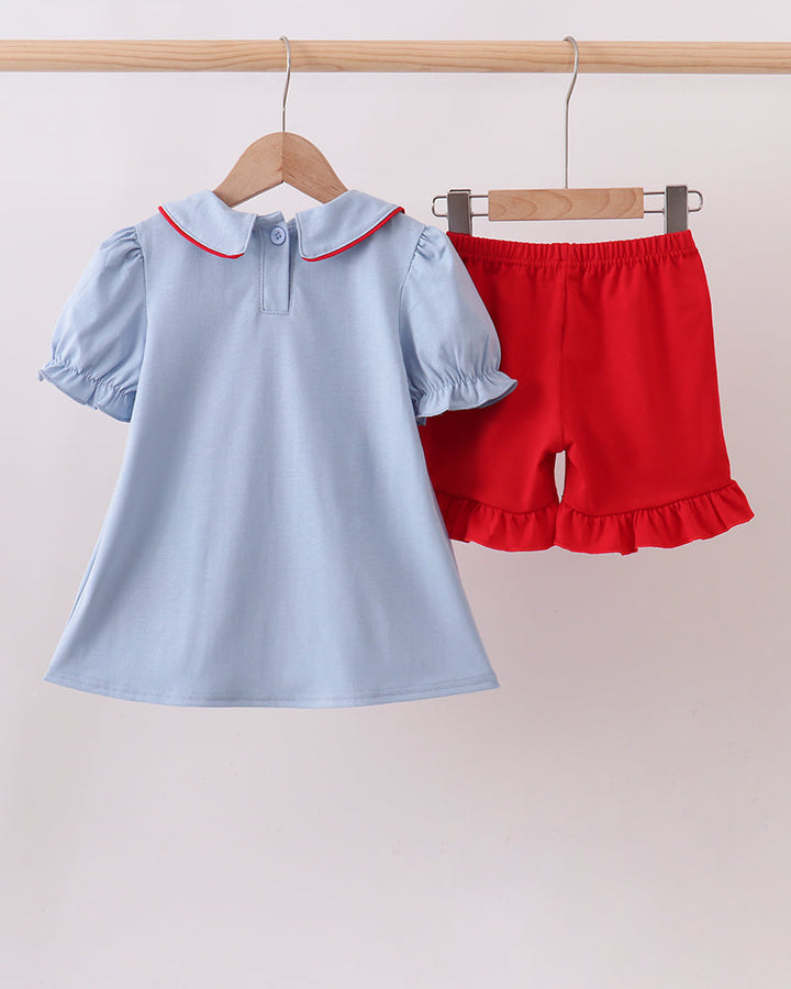 Light blue dress with red collar and red ruffle shorts set