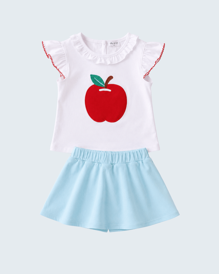 Girls white ruffle-neck top with apple applique and light blue skort