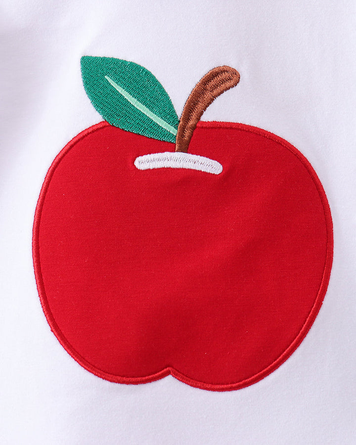 Red apple applique patch with green leaf on white fabric