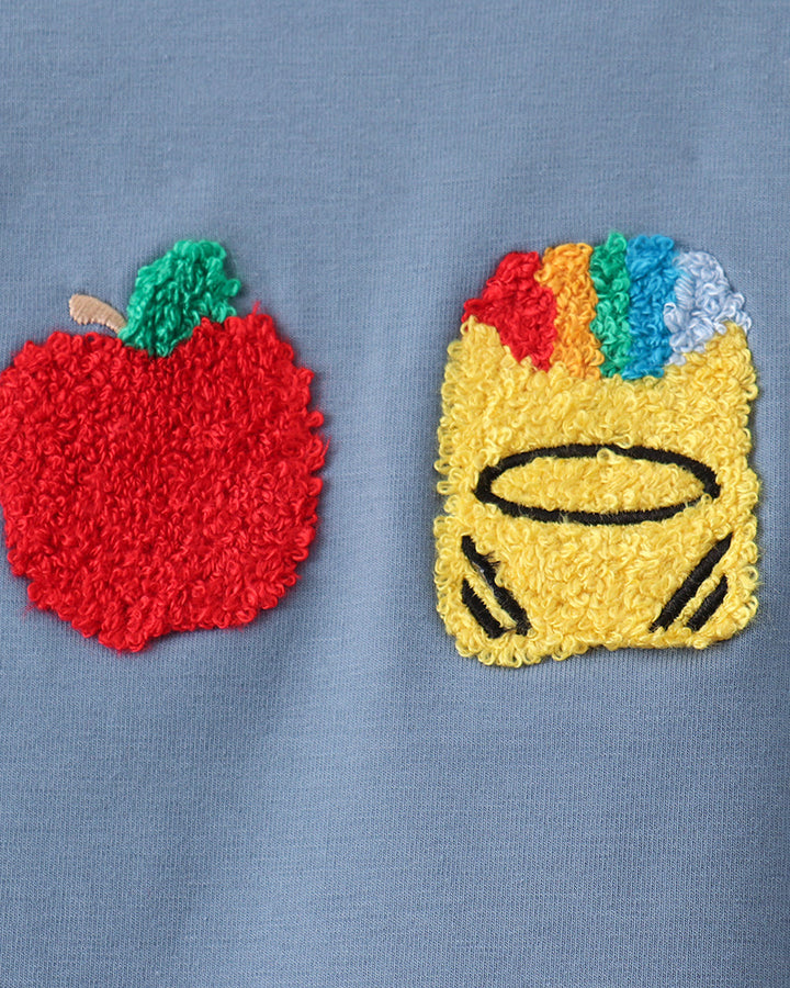 Blue shirt with colorful embroidered apple and crayon face patches