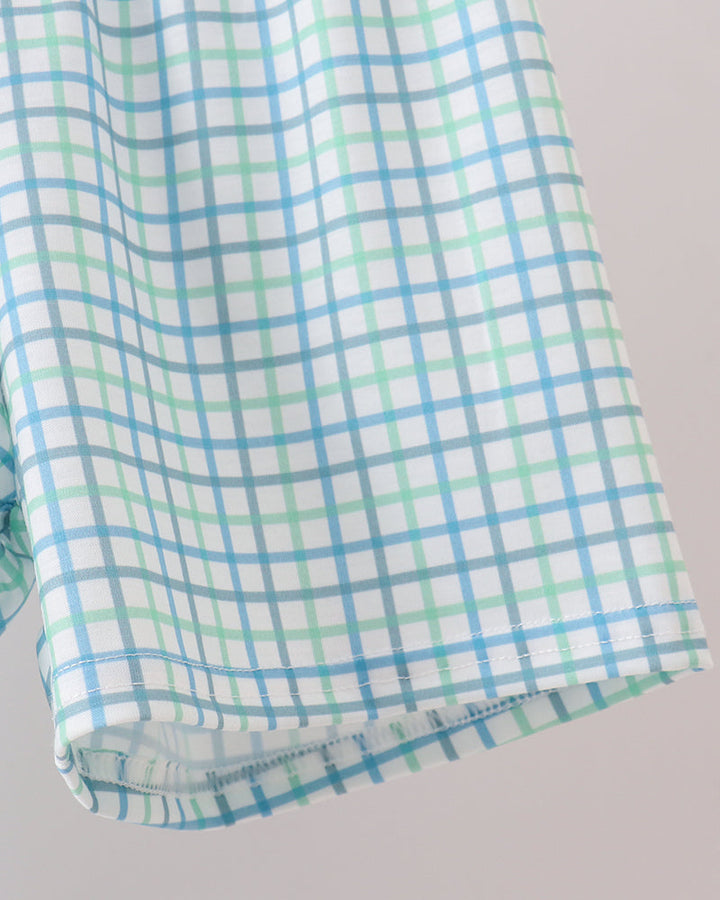 Light blue and green plaid shorts with stitched hem detail