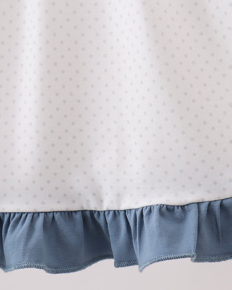 Girls white dotted dress with blue ruffle hem trim and gathered skirt