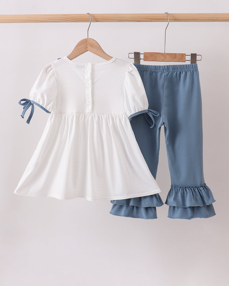 White ruffle top with colorful applique and light blue tiered pants set