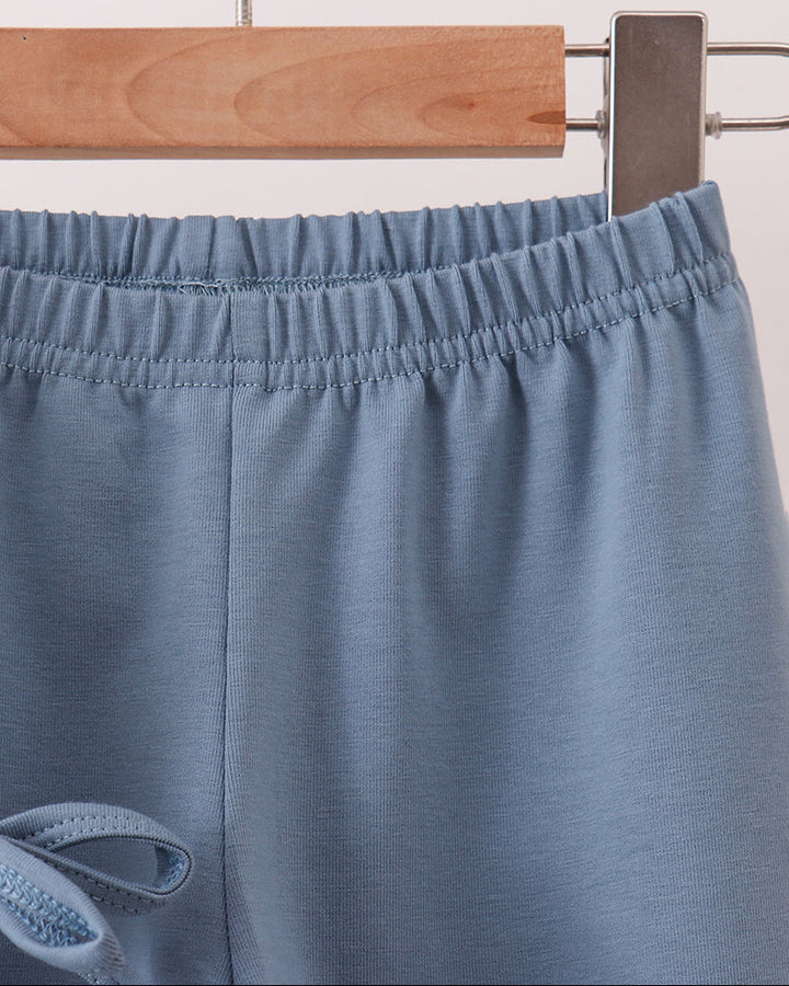 Light blue pants with elastic waistband and stitched side seams