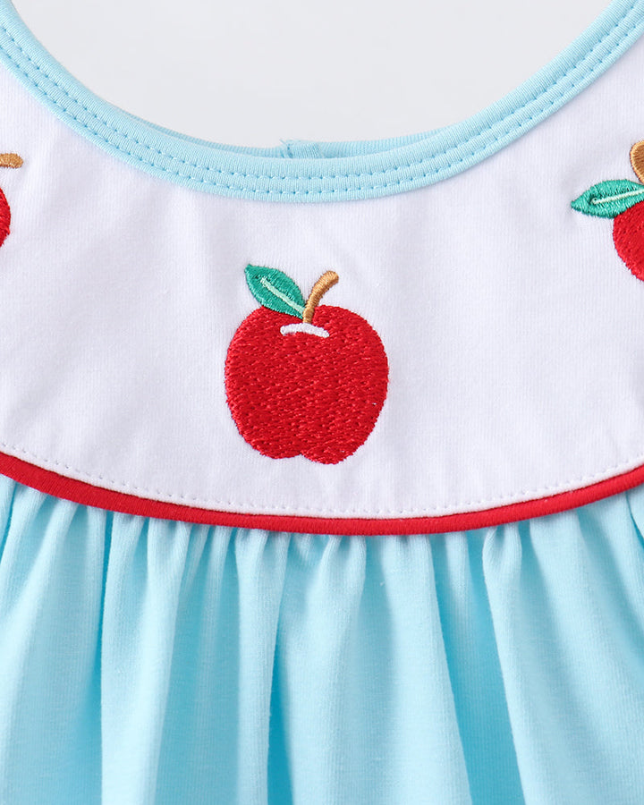Embroidered apples on a blue dress
