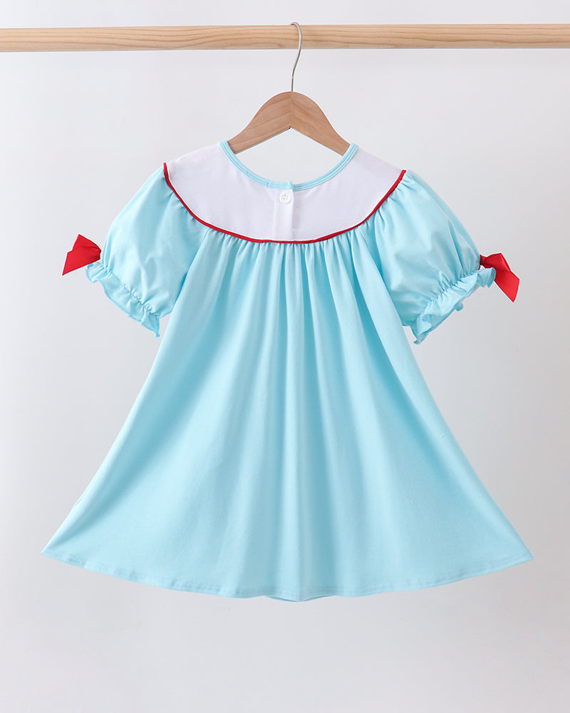 Blue Apple Embroidered Dress on wooden hanger
