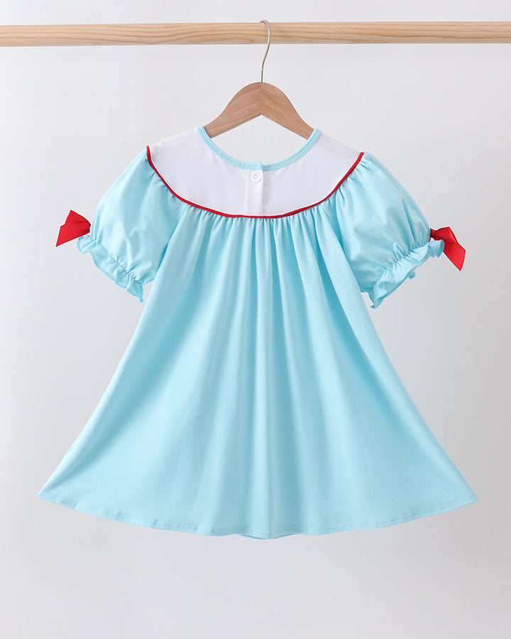 Blue Apple Embroidered Dress on wooden hanger