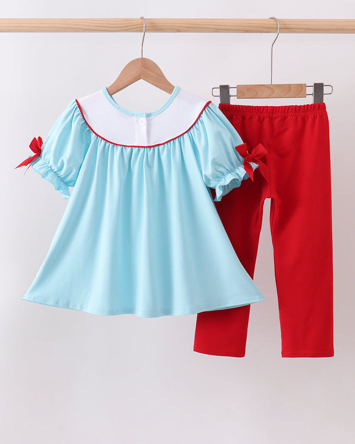 Blue Apple Embroidered Pants Set on wooden hanger