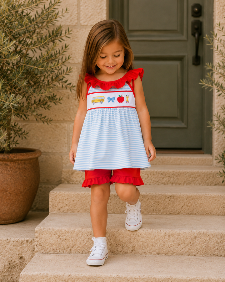 Girls wearing striped dress and red shorts set with ruffle bows and embroidery
