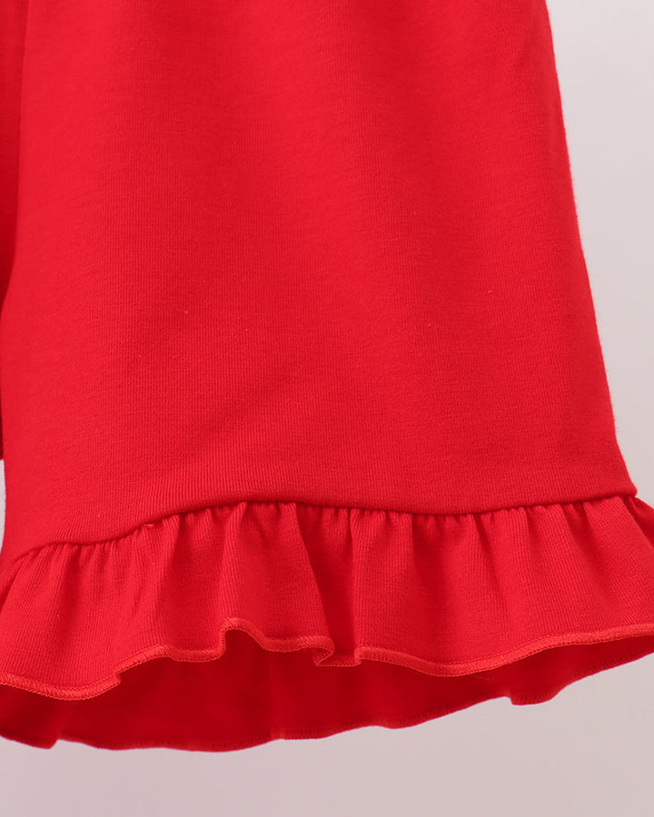 Red ruffle hem shorts with gathered waist and scalloped finish