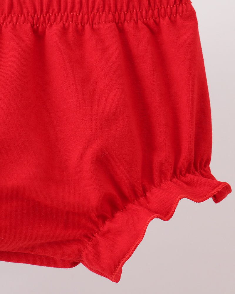 Red baby bloomers on a light gray background
