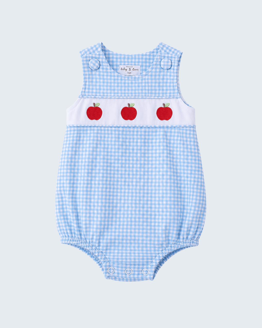 Light blue gingham smocked bubble romper with red apple print and button shoulder straps